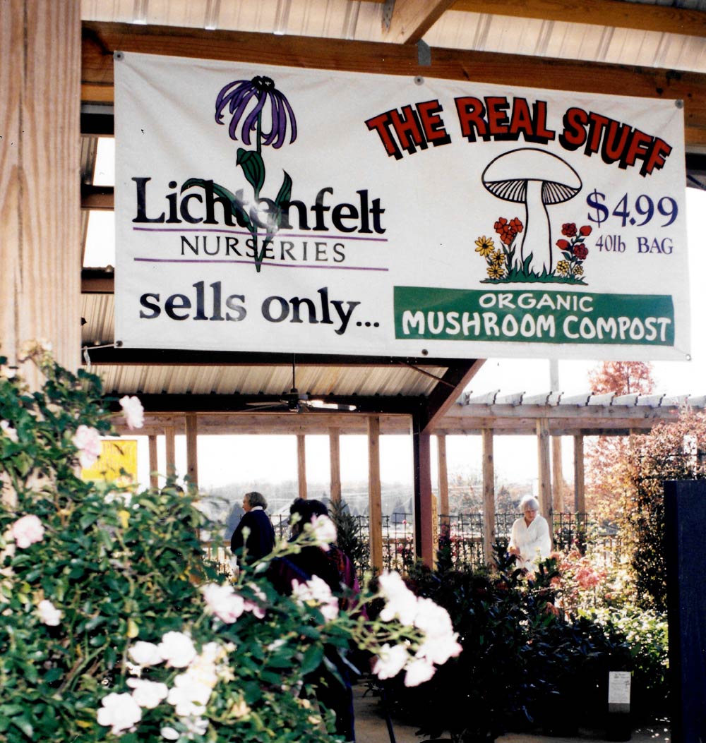 A hand-painted Lichtenfelt Nurseries banner advertising organic mushroom compost, “The Real Stuff”